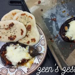 A picture of Imam Bayildi or Turkish stuffed Eggplants with Cheese.