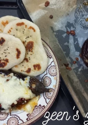 A picture of Imam Bayildi or Turkish stuffed Eggplants with Cheese.