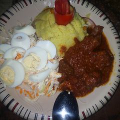 A picture of Fried cous-cous with stew.