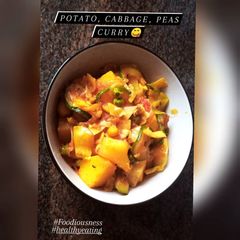A picture of Potato, cabbage, peas curry.