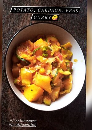 A picture of Potato, cabbage, peas curry.
