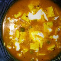 A picture of Matar paneer without onion and garlic.