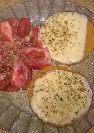 Una foto de Zapallito a la pizza con tomate