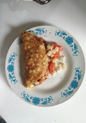 Una foto de Omelette con tomate, champiñón y queso de cabra