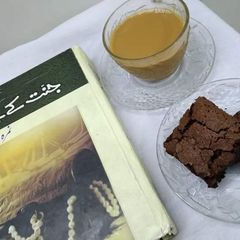 A picture of My strong tea with fav fudge brownies.