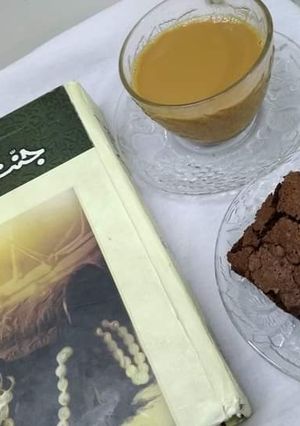 A picture of My strong tea with fav fudge brownies.