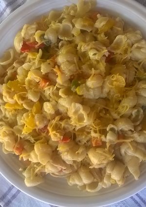 A picture of Macaroni with pasta sauce.