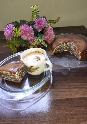 A picture of Çhocolate Çrepes Çake with Çoffee.