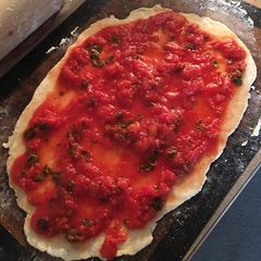 A picture of No oil no onion PIZZA SAUCE with fresh herbs.