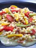 Fregola sarda con peperoni, datterini confit e gorgonzola