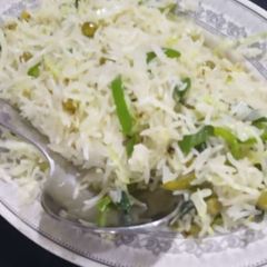 A picture of White and green rice.