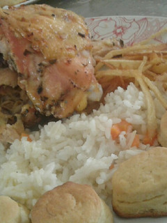A picture of Baked Chicken with French Fries and Rice.