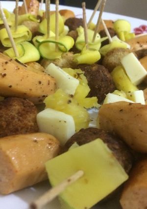 A picture of Sausage with Cheese and Pineapple Sticks.