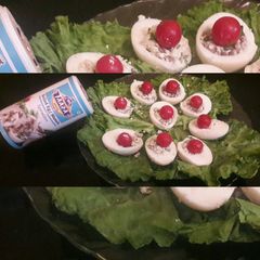 A picture of Stuffed Eggs with mushroom And cherry tomatoes.