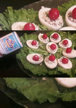 A picture of Stuffed Eggs with mushroom And cherry tomatoes.
