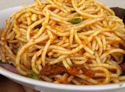 A picture of spaghetti with stir fried french beans