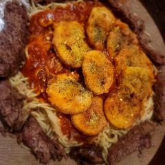 Roasted Beef with Fried Squash on Spaghetti Parmigiano A picture of Roasted Beef with Fried Squash on Spaghetti Parmigiano.