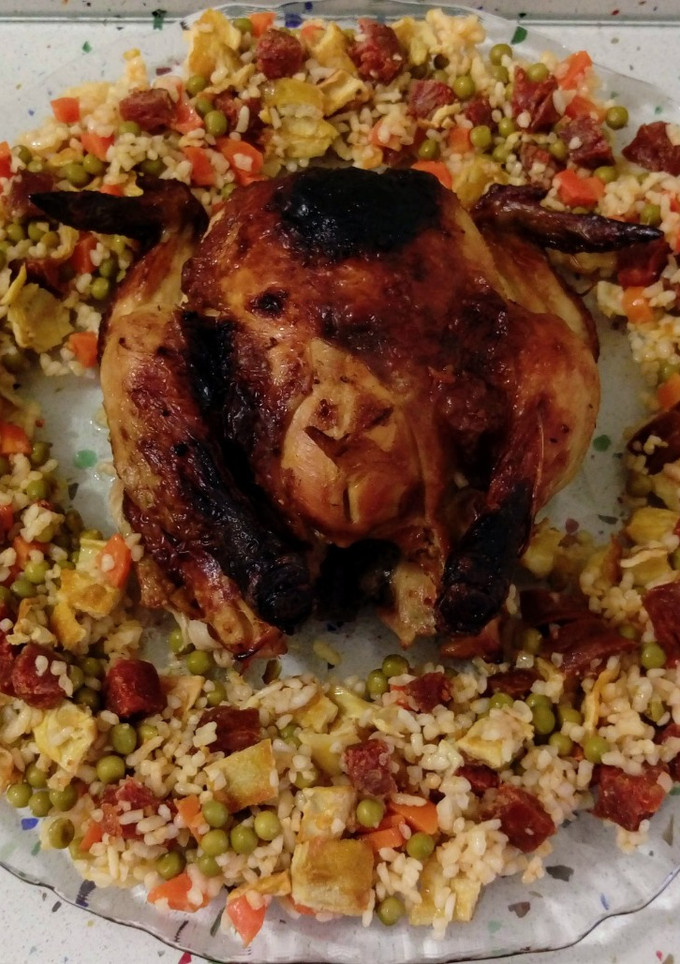 Una foto de Picantón asado y arroz cuatro delicias