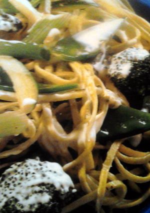 A picture of pasta with veggies.