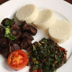 A picture of Ugali maini(beef liver with ugali and sauted spinach.