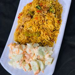 Chinese fried rice and cucumber salad A picture of Chinese fried rice and cucumber salad.