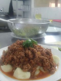 Una foto de Ñoquis con salsa boloñesa