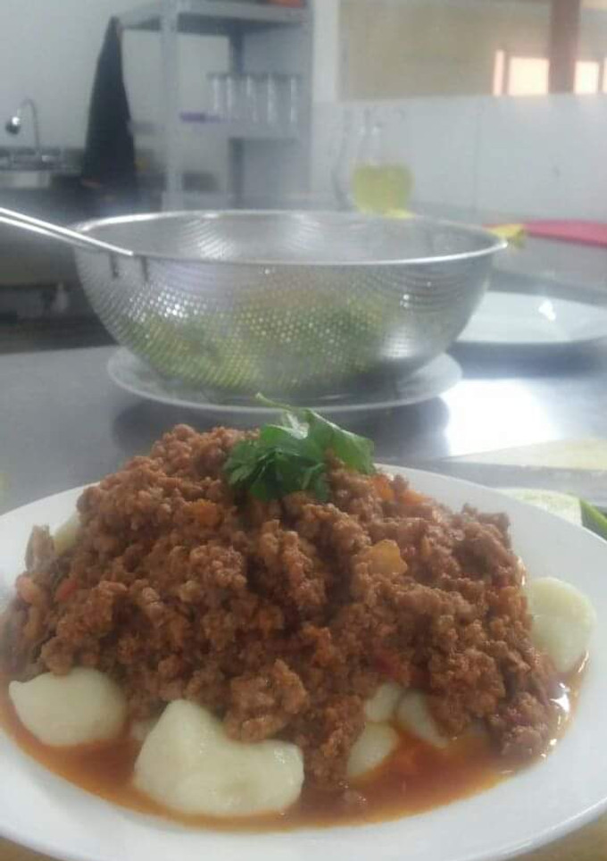 Una foto de Ñoquis con salsa boloñesa