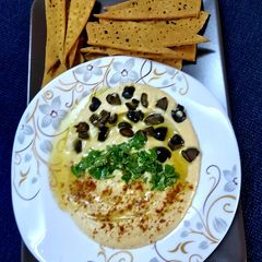 A picture of Hummus and lavash.