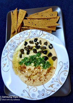 A picture of Hummus and lavash.