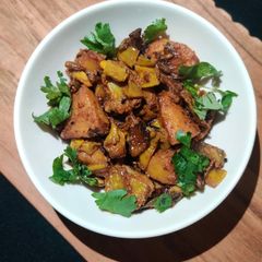 A picture of Sem Aloo with Kalonji Seeds.