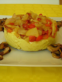 Una foto de Polenta con verdura salteada