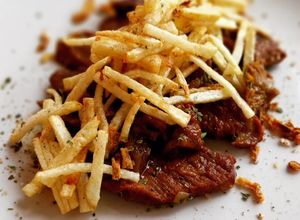 Foto principal de Presa ibérica en salsa de Oporto con patatas paja