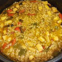 Una foto de Arroz meloso con choco y calamares en su tinta