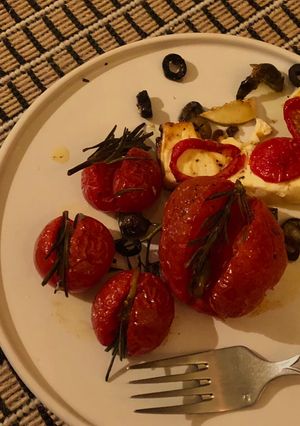 A picture of Feta, rosemary, tomatoes.