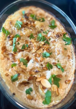 A picture of Baked cauliflower with tahini sauce.