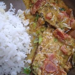 A picture of Rohu fish with curd and mustard powder.