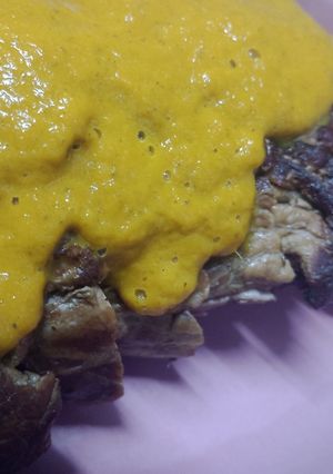 Una foto de Lomo a la cerveza con salsa de zanahoria