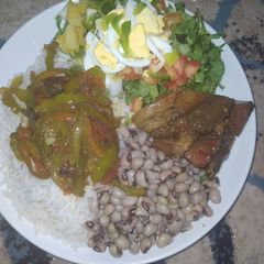 Rice and beans,salad,vegatable stir fry and beef sauce A picture of Rice and beans,salad,vegatable stir fry and beef sauce.