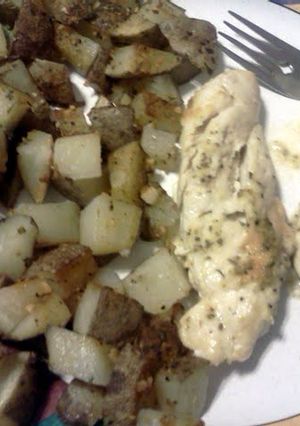 A picture of parmesan ranch chicken with roasted potatoes.