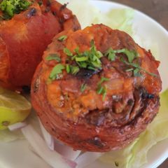 Tandoori stuffed tomatoes A picture of Tandoori stuffed tomatoes.