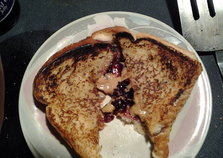 Steps to Make Any-night-of-the-week grilled peanut butter and jelly sandwich