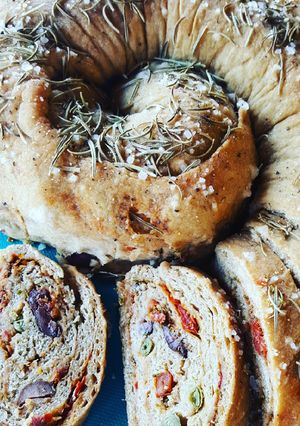 A picture of Focaccia with Tumminia Flour, Sun-Dried Tomatoes, Capers, and Olives.
