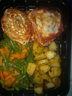 A picture of Breakfast idea- Fried Egg in Roasted tomato ring, veggies, stir fried potatoes.