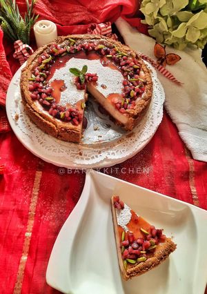 A picture of Cheese Cake with Pomegranate compote.