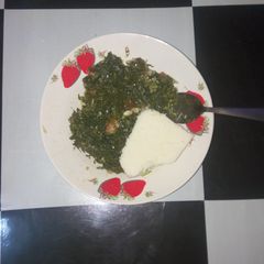A picture of Steamed kales served with corn balls(ugali).