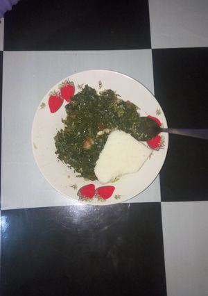 A picture of Steamed kales served with corn balls(ugali).