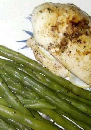 A picture of Spiced chicken breast with steam green beans.