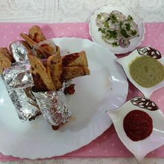 Chicken egg paratha chatpaty spicy rolls vary tasty mouth water A picture of Chicken egg paratha chatpaty spicy rolls vary tasty mouth water.