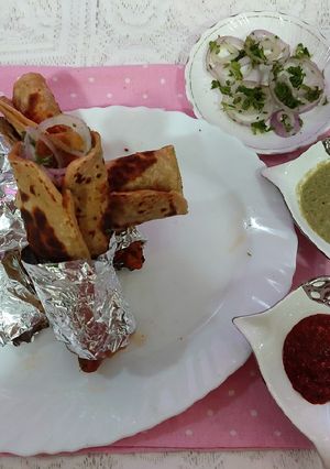 A picture of Chicken egg paratha chatpaty spicy rolls vary tasty mouth water.