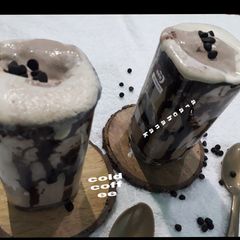 A picture of Cold coffee with icecream choco chips.